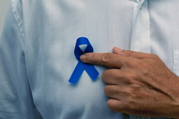 Blue november - man holding blue ribbon