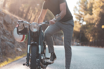 Naklejka premium a young biker about to ride his motorcycle.