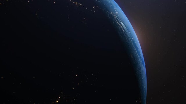 Amazing realistic animation of the earth seen from space, on dark background with moving stars. Sun illuminating the earth. High quality 3D animation. 4K UHD.