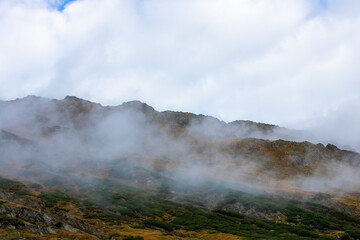 landscape with the ridges of the Fagaras mountains among the clouds