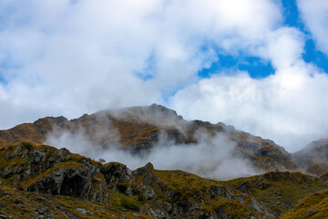 landscape with mountain ridges in the fog