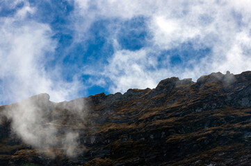 landscape with the ridges of the Fagaras mountains among the clouds