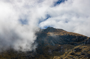 Landscape with clouds on mountain ridges