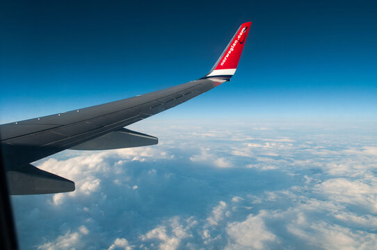 Red Wing Of A Norwegian Airlines Plane
