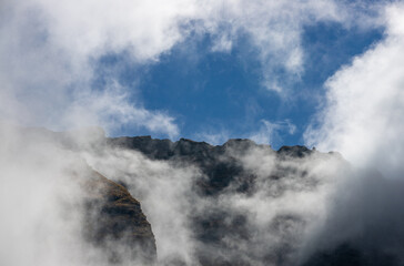 landscape with clouds on top of mountain ridges
