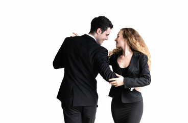 Happy caucasian man and woman couple in suit dancing isolated on white background. Professional successful couple embracing. Models in love, relationship, dating, flirting, lovers, romantic .