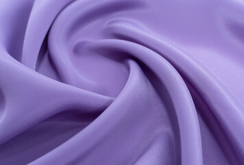 A piece of purple cloth. Fabric texture for background and design works of art, beautiful wrinkled...