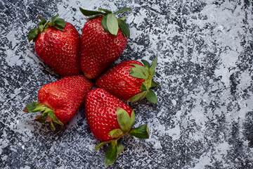 top view five strawberry on gray background