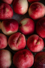 Beautiful ripe peaches and nectarines on the market counter. Great fruit background.