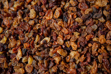 Obraz premium Beautiful raisins on the market counter. Dried fruits close-up.