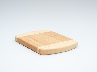 Bamboo cutting board on a white background.