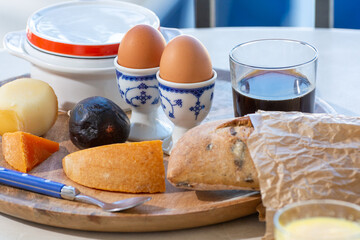 Continental breakfast with soft-boiled chicken egg served outdoor