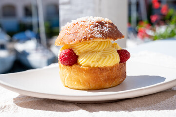 Tarte tropezienne or La Tarte de Saint-Tropez - dessert pastry consisting of filled brioche with cream and fresh berries.