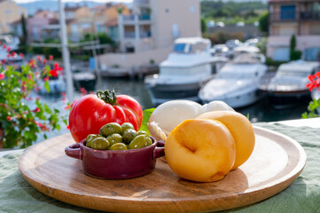 Cheese collection, Italian cheese scamorza made from cow milk in South of Italy served with green olives and red tomato