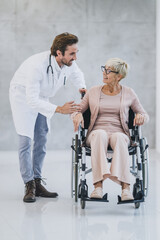 Fototapeta na wymiar Doctor Helping A Senior Woman In A Wheelchair