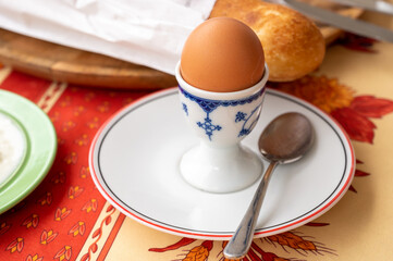 Continental breakfast with soft-boiled chicken egg served outdoor