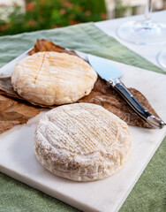 Cheese collection, semi-hard French blue cheese roquefort from Roquefort-sur-Soulzon, France served with sweet cold white french wine
