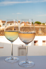 Summer on French Riviera Cote d'Azur, drinking cold rose and white wine from Cotes de Provence on outdoor terrase in Port Grimaud, Var, France