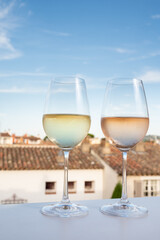 Summer on French Riviera Cote d'Azur, drinking cold rose and white wine from Cotes de Provence on outdoor terrase in Port Grimaud, Var, France
