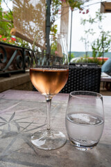 Summer on French Riviera Cote d'Azur, drinking cold rose  wine from Cotes de Provence on outdoor terrase in cafe