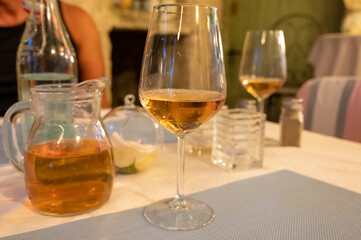 Summer on French Riviera Cote d'Azur, drinking cold rose from Cotes de Provence on outdoor terrase in old cafe, Var, France