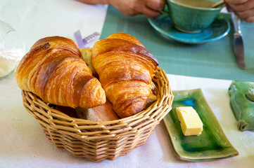 French breakfast, fresh baked croissant buttery pastry served with coffee