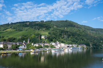 Fototapeta na wymiar View on Mosel river, hills with vineyards and old town Traben-Trarbach, Germany