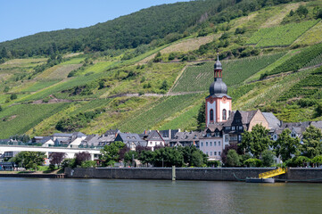 View on Mosel river, hills with vineyards and old town Zell, Germany