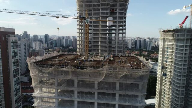 Aerial drone view of the Brooklin neighborhood in S&atilde;o Paulo, Brazil. Four tall buildings under construction