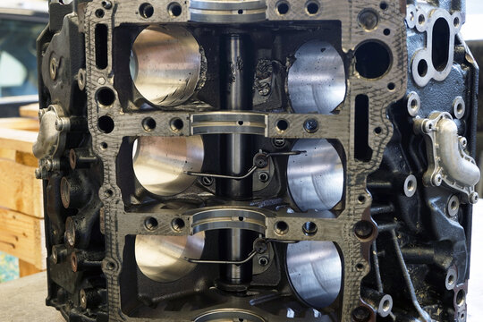 The partially disassembled engine is located on the workbench for troubleshooting and repair. Selected focus.