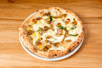 Italian pizza with tartufata recipe with confit mushroom shake, sunflower oil, capers, anchovies, black olives, black truffle and garlic