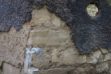 Scary shabby wall in grunge style. Rough textured surface. A background for a blank