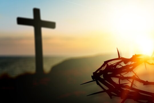 Crown of thorns of Jesus Christ against wooden catholic cross at outdoor  background Stock Photo | Adobe Stock
