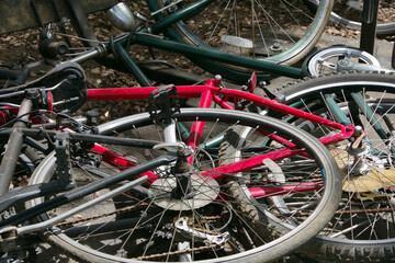 Fototapeta na wymiar Close-up view of abandoned bicycles on the ground