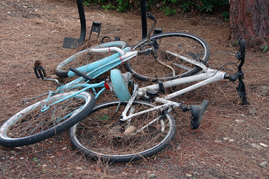 Close-up view of abandoned bicycles on the ground