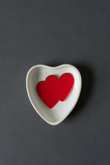 Obraz premium two hearts in a heart shaped dish