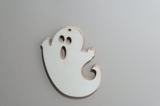pile of ghosts - wooden laser cut plywood shapes on paper