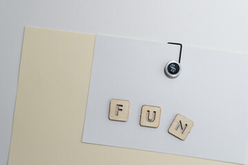 fancy paper clip with the word "fun" on paper
