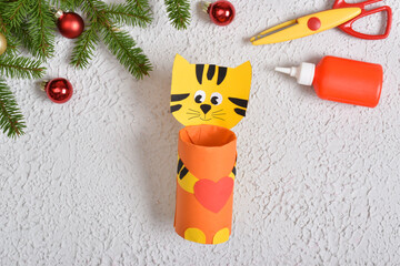 Christmas craft. A New Year's gift with your own hands is an animal tiger.