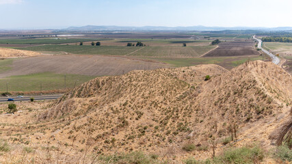 Obraz premium The view from Tel Megiddo Nation Park of the Jezreel Valley in northern Israel. 