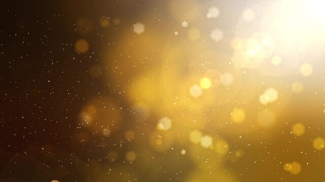Golden blurred motion background with particles, lights and snow.