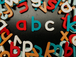 Colorful alphabet letters on a black background