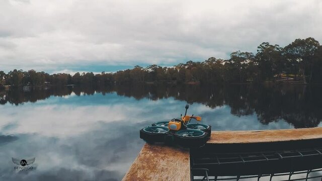 Timelapse - Kennington Reservoir Bendigo with moving clouds and cinewhoop fpv drone in background