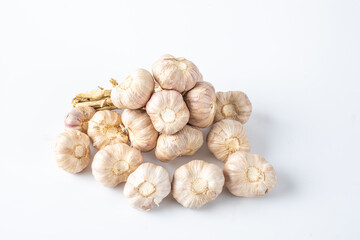 Garlic Cloves and Garlic Bulb on white background. Concept healthy lifestyle.