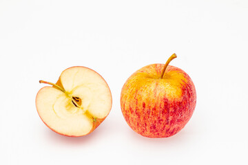 Red yellow apple whole and halves piece isolated on white background.