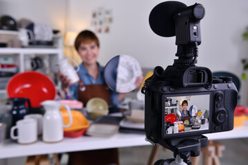 Asian woman blogger vlogger and online influencer recording video content on online marketing and selling and e-commerce for ceramic making and products