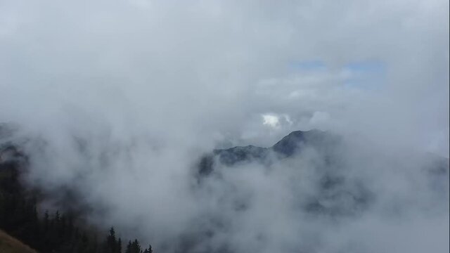 Flying a drone in low-hanging clouds high in the alps of Austria