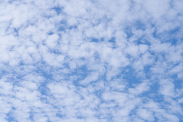 blue sky background with white clouds. Autumn blue sky