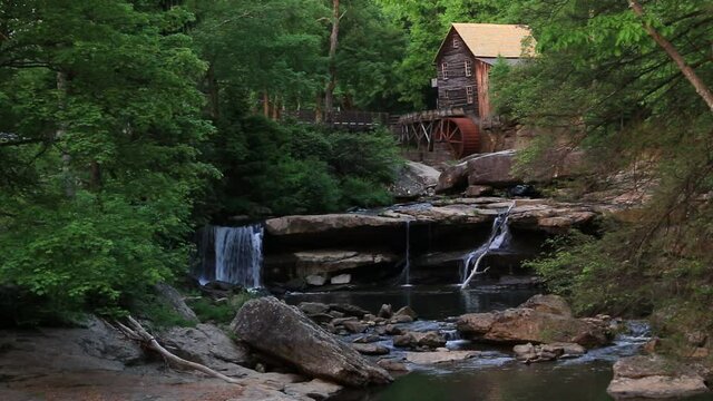 serene summer video of the Glade Creek  Grist Mill and cascading waters in Babcock State Park in West Virginia.