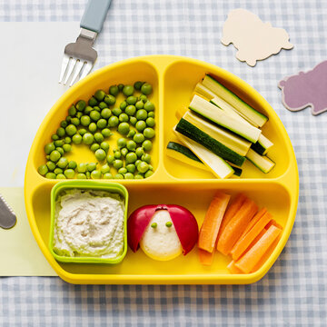Kids healthy finger foods on yellow plate
